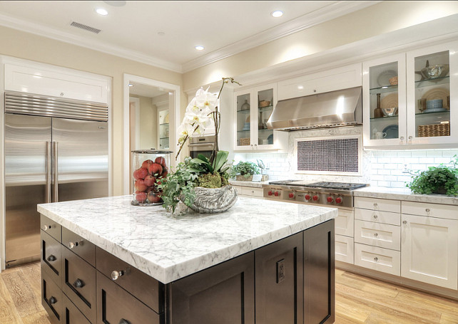 Kitchen. White Kitchen. Transitional Kitchen. Modern Kitchen. Kitchen with white cabinets, glass front cabinets and dark stained kitchen island. #Kitchen