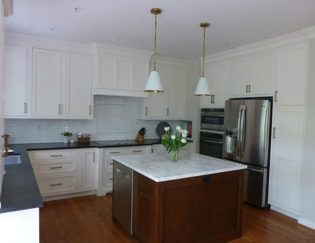 Kitchen. White kitchen with inset cabinet doors painted in Benjamin Moore White Dove and custom cherry kitchen island with polished Mont Blanc marble. #kitchen Kate Abt Design.