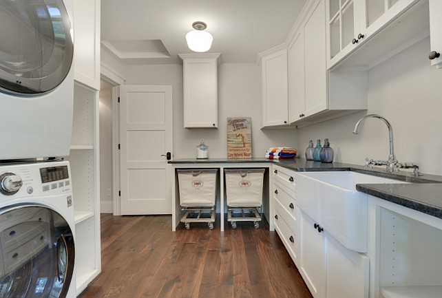 Laundry room. Laundry room paint color. The millwork is BM-Dove White, the walls are Sherwin Williams City Loft. Divine Custom Homes.