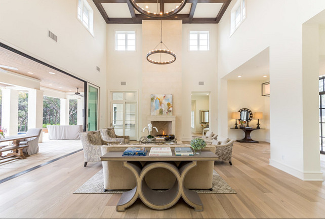 Living Room. Open Living room with high ceiling. Open and bright living room. Living room chandeliers are from Visual Comfort. Butter Lutz Interiors, LLC.