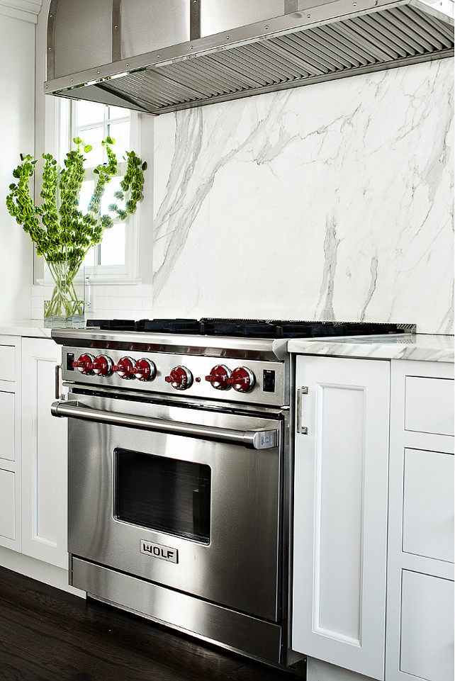 Marble Slab Backsplash. Kitchen with marble slab backsplash. The marble backsplash is nature's own artwork. #Kitchen #Slab #MarbleSlab #marble #Backsplash Heidi Piron Design & Cabinetry.