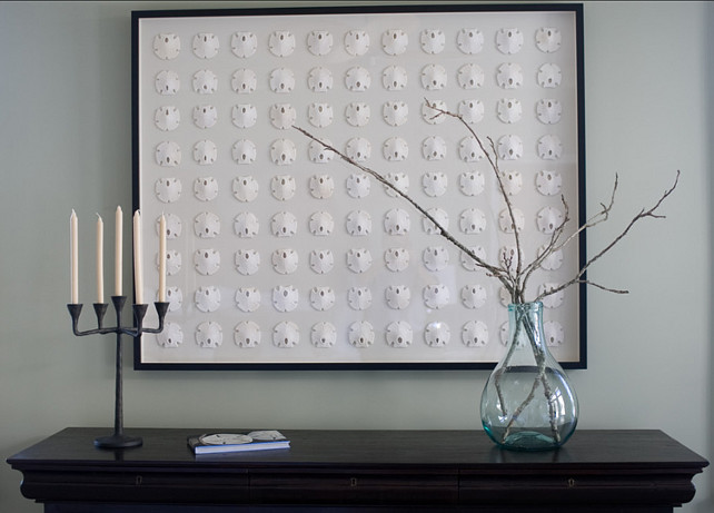 Sand Dollar Art. Although large, the simplicity of the framed sand dollars are strong enough to carry the room