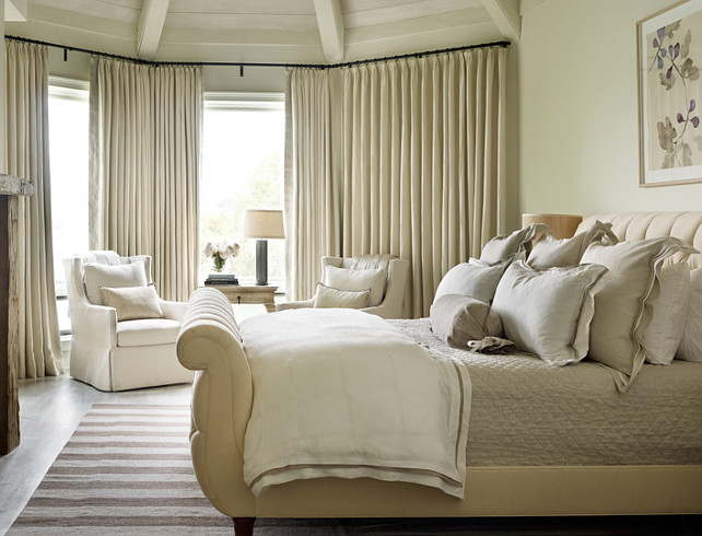 Master Bedroom. Master Bedroom with neutral decor and fireplace. The arm chairs in the master bedroom are from Bungalow Classic in Atlanta, Georgia. Interior Design by Beth Webb Interiors.