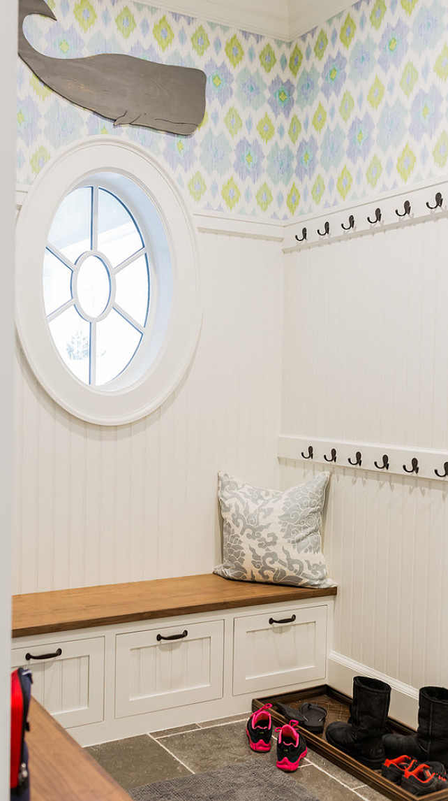 Mud Room. Coastal Mud room. Coastal mud room. Small coastal mud room. The mudroom boasts blue and green ikat wallpaper on upper walls and beadboard trim on lower walls. #Mudroom #Coastal #Smallspaces Brookes and Hill Custom Builders.