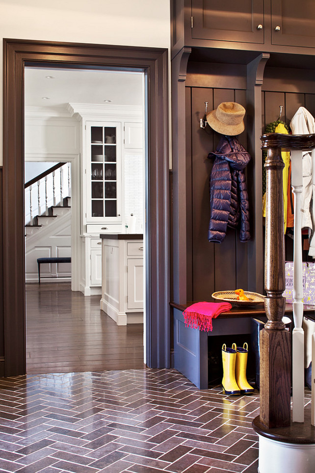 Mud room. Mud room Ideas. Mud Room Cabinet Ideas. The mud room features custom cabinetry with individual lockers and a durable herringbone tile floor. #Mudroom Alisberg Parker Architects.