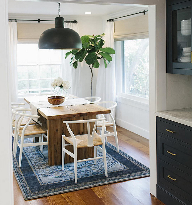 Navy Butlers pantry leading to dining room with navy decor. #Navy #interiors Shea McGee Design.