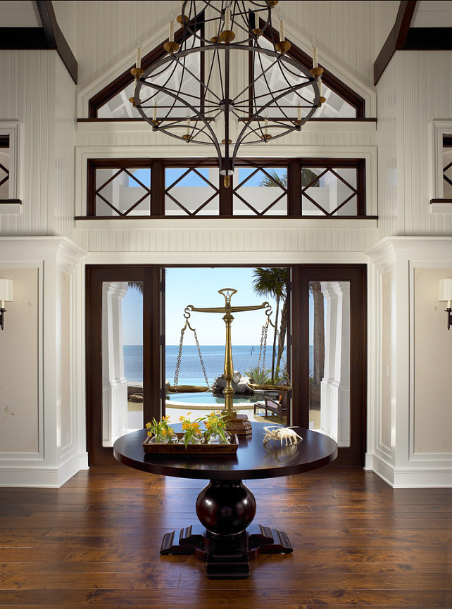 Foyer. This is one of the best foyer design I have seen! Love the ocean view, the architecture details and decor. #Foyer #Interiors