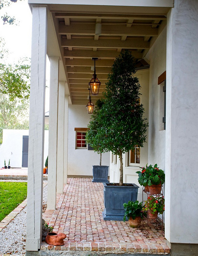 Porch. Front Porch. Rustic farmhouse porch. Rustic farmhouse porch with brick flooring and stucco exterior with lahabra finish. Whitestone Builders.