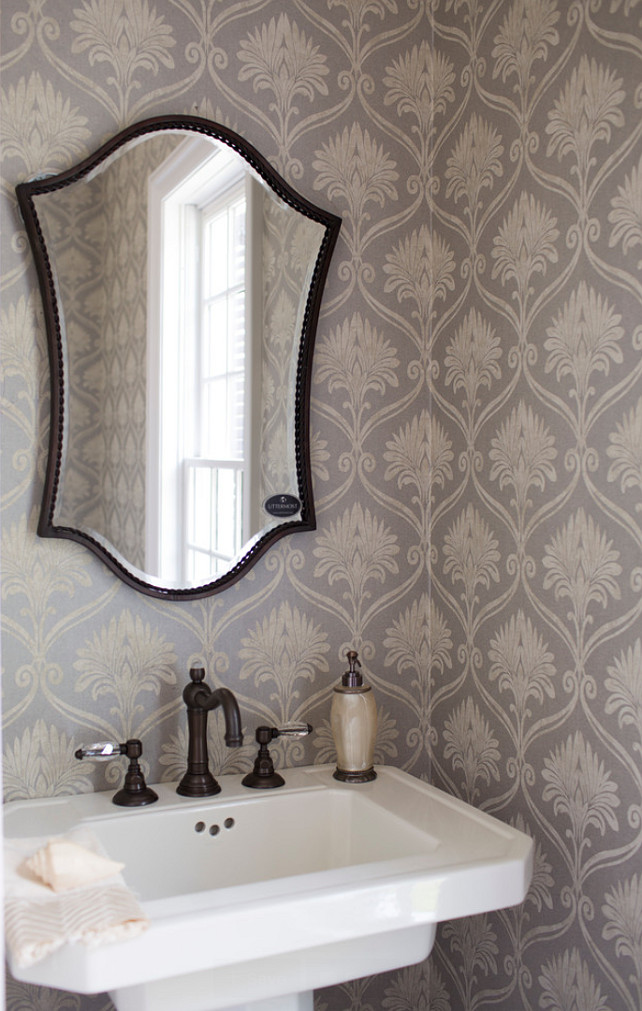 Powder room. Powder room with pedestal sink and gray wallpaper. #PowderRoom #pedestalSink ##GrayWallpaper Whitestone Builders.