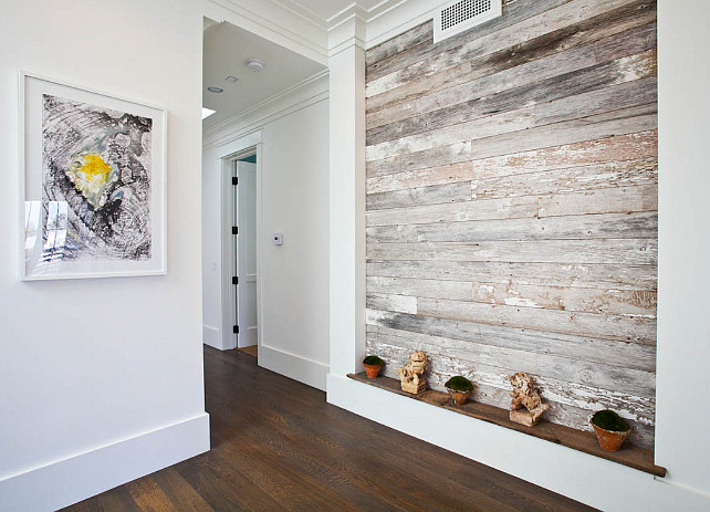 Reclaimed wood. Reclaimed wood plank wall. Foyer with reclaimed wood plank wall.