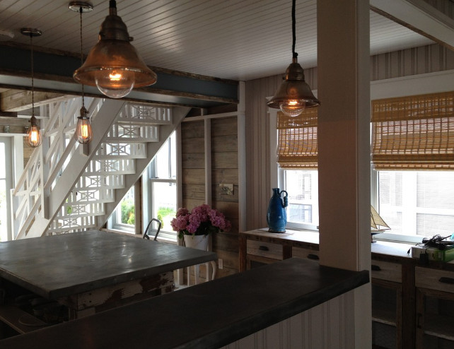 Rustic Kitchen with reclaimed wood walls, plank flooring, plank walls, wicker blinds, white staircase, antique lighting make this cosy space a light and friendly environment. #kitchen #Rustic #Plank