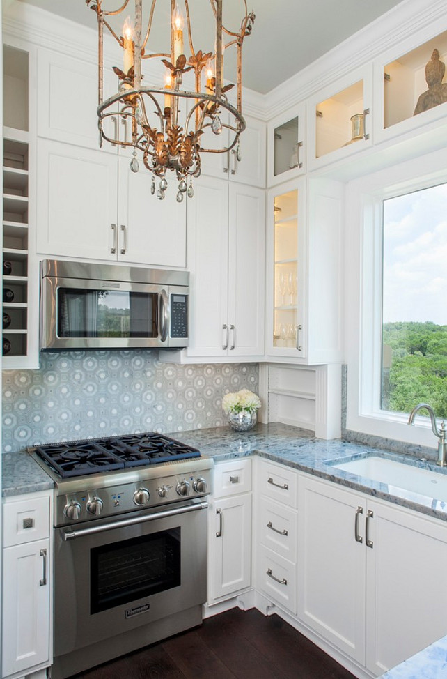 Stone Backsplash. Kitchen Stone Backsplash. The backsplash is a glass and stone pattern by Artistic Tile. #Backsplash #StoneBacksplash Bravo Interior Design.