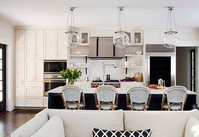 Transitional Kitchen Design #TransitionalKitchen Transitional kitchen with clear glass globe pendants over kitchen island. TerraCotta Properties