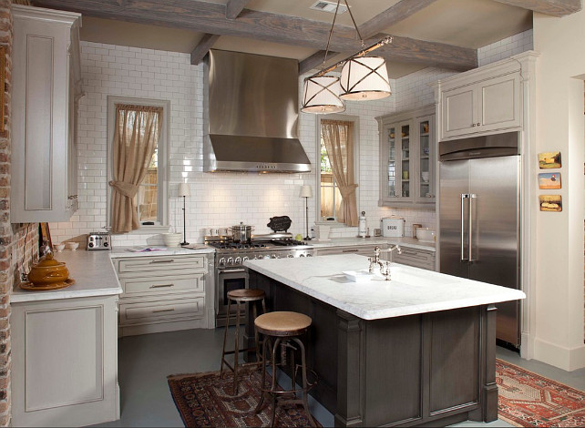 Transitional kitchen. Transitional kitchenwith beamed ceiling, countert to ceiling subway tiles. Pendant above kitchen island is the Grosvenor 2 light from Circa Lighting. Whitestone Builders.