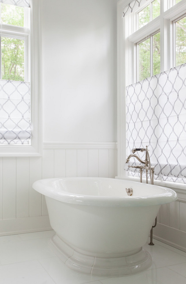 White Bathroom Flooring. White Bathroom with freestanding bath. White Bathroom with Roman shades. #Bathroom #WhiteBathroom Duneier Design.