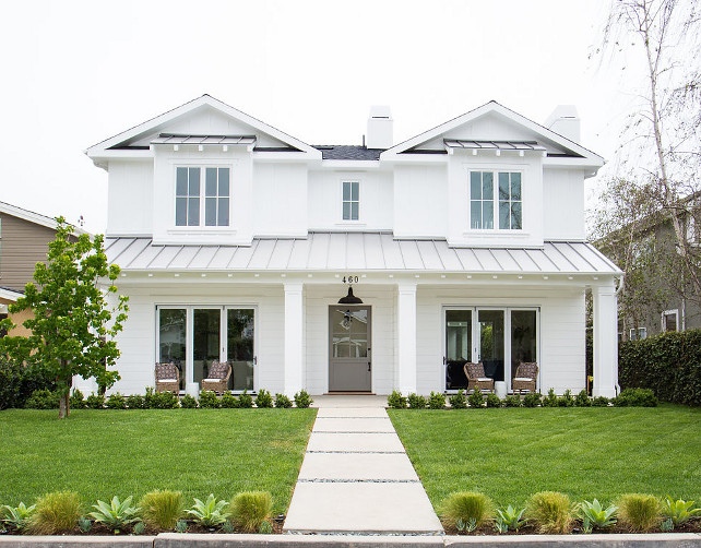 White Exterior Paint Color. White Home Exterior Paint Color Ideas. White Home Exterior. Classic White Home Exterior with Gray Front Door and Metal Roof. #WhiteHomeExterior Graystone Custom Builders.