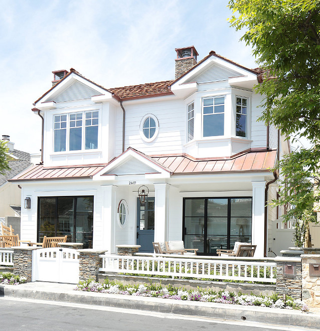 White Home Exterior. Beach house with white exterior, metal roof and grey front door. #WhiteExterior #GreyDoor #greyFrontDoor #MetalRoof #BeachHouse Blackband Design.