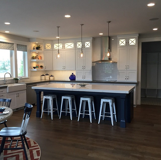 White Kitchen with Navy Blue Island. Kitchen with white cabinets and navy kitchen island. #NavyIsland #NavyKitchenIsland #NavyBlueKitchenIsland Candance Homes. Four Chairs Furniture & Design.