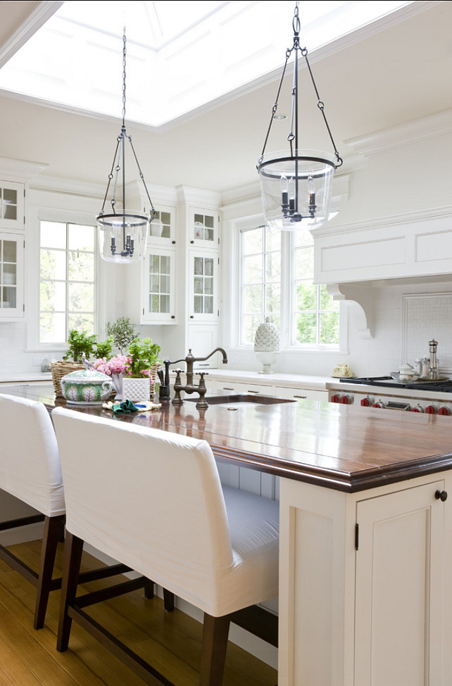 White Kitchen. Traditional white kitchen with off-white cabinets, butcher's block countertop, classic white subway tiles. #Kitchen #WhiteKitchen #TraditionalKitchen 2 Ivy Lane.
