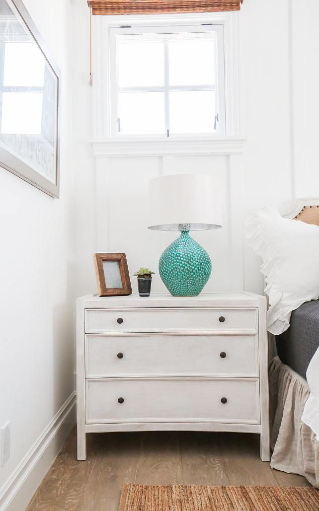 White Nightstand. Coastal bedroom with White Nightstand and turquoise table lamp. #WhiteNightstand #CoastalBedroom #CoastalInteriors #Turquoise #TurquoiseLamp Blackband Design.