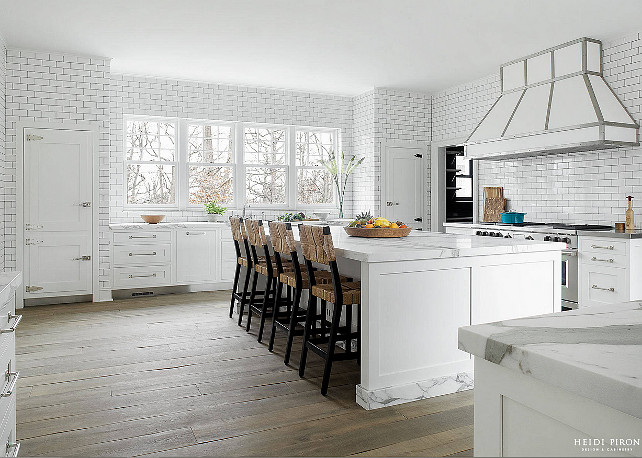 White Transitional Kitchen. White kitchen wity floor-to-ceiling wall tiles. Heidi Piron Design.