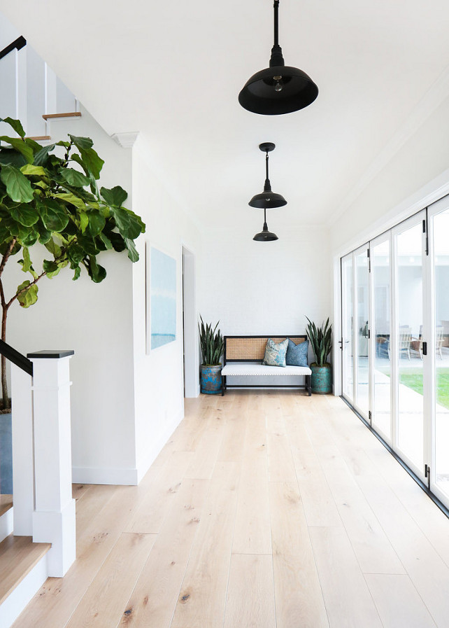 Whitewashed hardwood flooring. Entryway. Entryway with whitewashed hardwood floors. Whitewashed hardwood plank Hardwood floor. Blackband Design