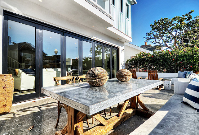 Zinc Table. Zinc Table Ideas. Outdoor Zinc Table. A reclaimed v base trestle zinc top dining table brings interest to this outdoor dining area. #ZincTable