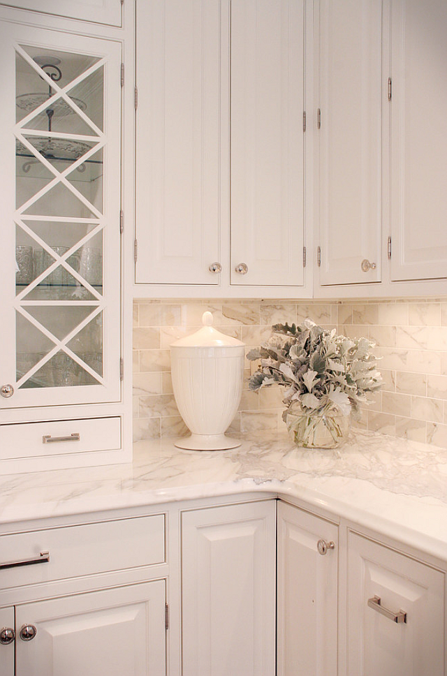 White Kitchen with Stacked Cabinets and Grey Island - Home Bunch